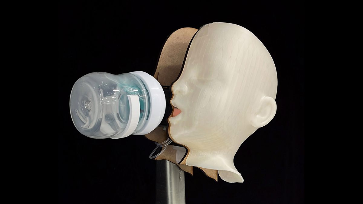 BabyBot robot with an infant-like head and feeding bottle